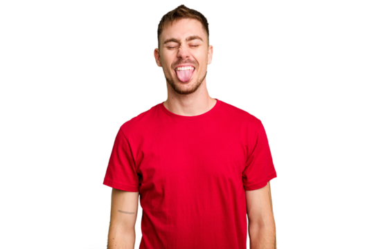 Young caucasian man cut out isolated funny and friendly sticking out tongue.