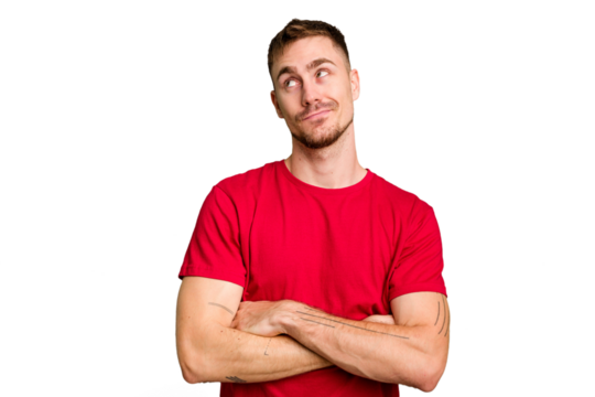 Young caucasian man cut out isolated dreaming of achieving goals and purposes