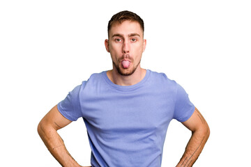 Obraz premium Young caucasian man cut out isolated funny and friendly sticking out tongue.