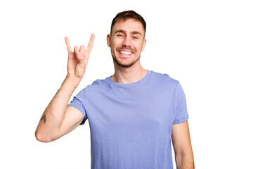 Naklejka premium Young caucasian man cut out isolated showing a horns gesture as a revolution concept.
