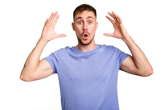 Young caucasian man cut out isolated celebrating a victory or success, he is surprised and shocked.