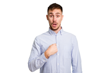 Young caucasian man cut out isolated surprised pointing with finger, smiling broadly.