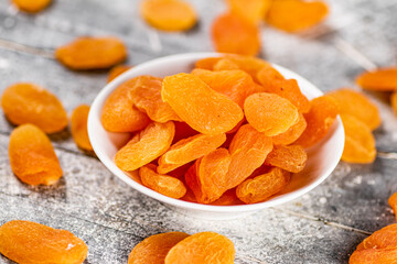 Fragrant dried apricots in a bowl on the table. 