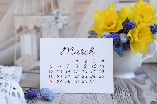 March calendar and spring flowers