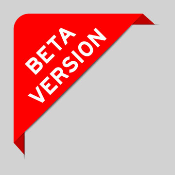 Red color of corner label banner with word beta version on gray background