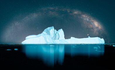 Melting icebergs by the coast of Greenland with milky way galaxy -  Melting of a iceberg and...