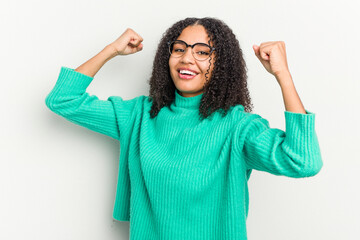 Young african american woman isolated on white background cheering carefree and excited. Victory concept.