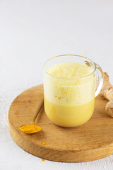 Turmeric latte tea from almond milk, ginger, turmeric and cinnamon, sugar and lactose free.