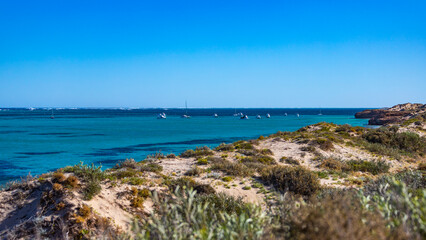 panorama of coral bay in western australia; a small resort with a yacht marina on the ningaloo reef