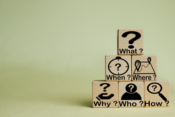 5W1H Root cause analysis.,Wooden cubes with the words and icons What, When, Why, Who, Where, and How on a yellow background use for business concepts such as problem-solving and strategic planning.