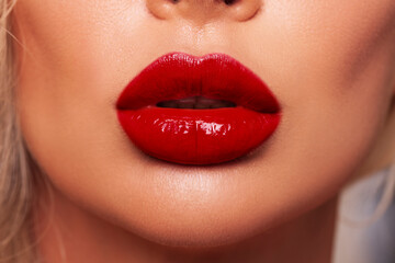 Sexy Red Lips close up. Beautiful Perfect Makeup. Beautiful red Lip Gloss. Cosmetic mouth open, big...