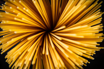A bunch of dry pasta on the table. 