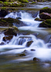 Water concept,river water flowing with light reflecting ,long exposure,light spots,

