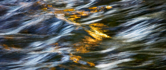 Water concept,river water flowing with light reflecting ,long exposure,light spots,grunge background with space,art background for design,