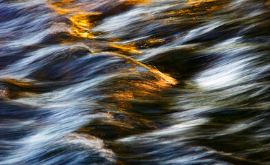 Water concept,river water flowing with light reflecting ,long exposure,light spots,grunge...