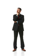 Businessman in a suit standing with thoughtful serious face over white studio background. Working day. Concept of business, career, innovations, ad