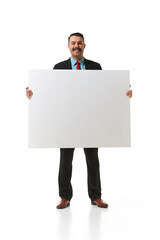 Businessman in a suit holding big empty paper for text, graph over white studio background. Concept of business, career, innovations, ad