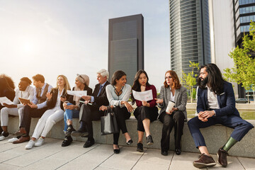 Multiracial business people working outdoor from office building - Focus on asian girl face