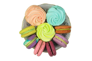 Sweet desserts in plate for the holiday. Macaroons and marshmallows isolated on white background. Top view.