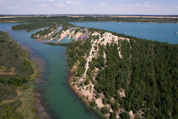 view of the lake with many meanders and crystal water from the drone