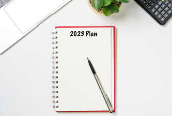 Blank Notebook with 2023 for action plan on working desk office , Business planing and action plan to achieve target and goal concept.