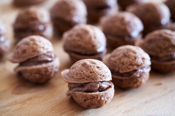 Homemade Christmas pastry in the shape of walnuts filled with chocolate cream