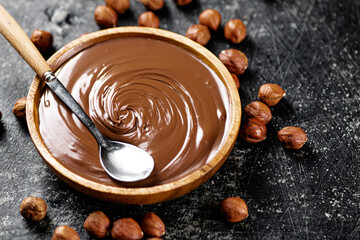 Hazelnut butter in a plate with a spoon. 