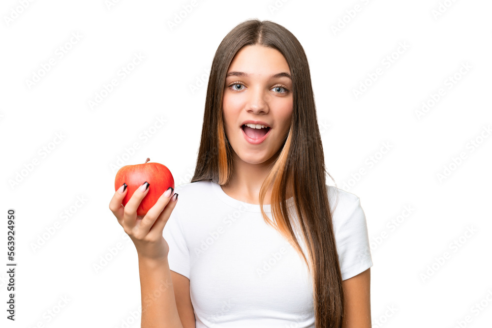 Canvas Prints Teenager caucasian girl holding an apple over isolated background with surprise and shocked facial expression