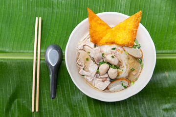 Pork noodles, meatballs, and fresh vegetables and warm soup . delicious food of Asian people.