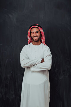 Portrait of young muslim man wearing traditional clothes
