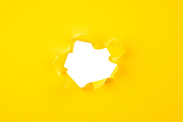yellow Hole paper with torn sides.