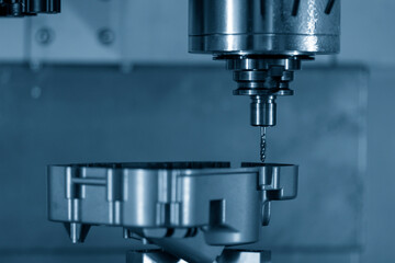 The CNC milling machine tapping process at automotive aluminum part.