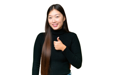 Young Asian woman over isolated chroma key background giving a thumbs up gesture