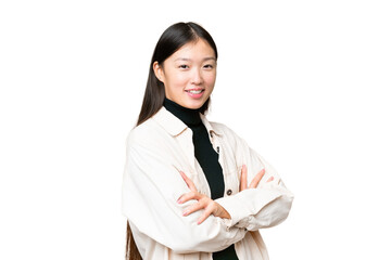 Young Asian woman over isolated chroma key background with arms crossed and looking forward