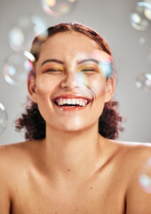 Bubbles, happy face and beauty woman in studio for skincare cosmetics, natural skin and...