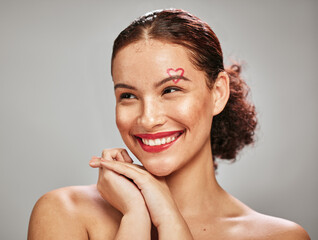 Beauty woman, makeup and heart face of a happy model in studio for cosmetics and dermatology....