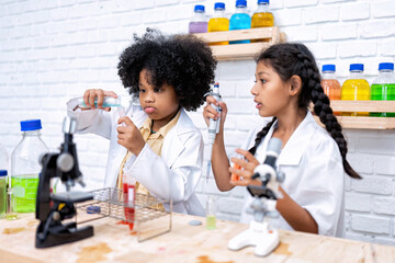 Elementary School Science student have fun playing biochemistry research in chemistry class room