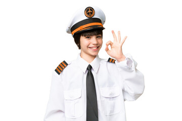 Little girl as a Airplane pilot over isolated chroma key background showing ok sign with fingers