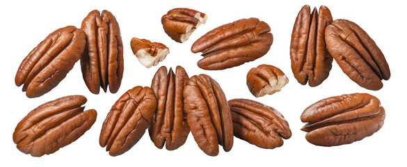 Pecan nuts, whole and pieces, scattered group isolated on white background. Top view.
