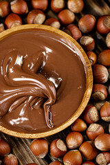 Hazelnut butter on a wooden plate. 