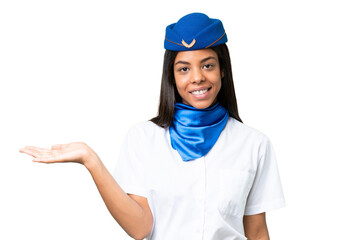 Airplane stewardess African american woman over isolated background presenting an idea while looking smiling towards