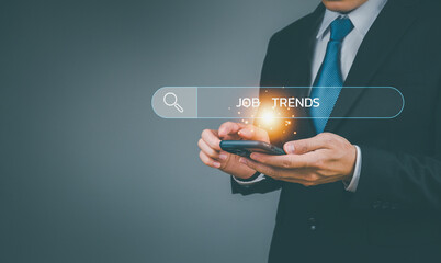 2023 New year businessman using smartphone for job search ideas, business top trend for marketing and concept. Make a business plan for the future change of the world.