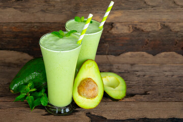  Avocado fresh cocktail smoothies fruit juice beverage healthy the taste yummy in glass drink episode good morning on wooden background.
