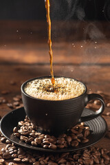 Coffee hot and Black Cup, pouring coffee into a black cup on rustic wood, dark food style photo, selective focus.