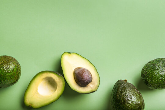 Haas avocados on green background