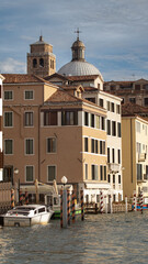 Typical Venetian buildings along the canals of the wonderful city floating on the water (Italy).