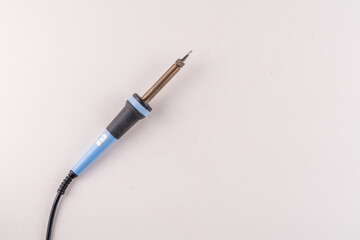 Selective focus top view of soldering iron isolated on white background with text space.