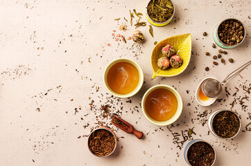 Various types of tea and hot brew in a cups from above (top view, flat lay). Chinese tearoom...