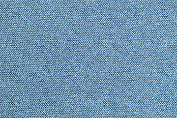 Fototapeta na wymiar Blue jeans texture. Fabric structure background. Clothing textile pattern. Closeup fashion material. Closeup textile background. Apparel clothes. Casual wear. Knit pattern. Blue fabric texture.