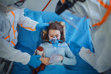 Close-up of little girl with infection disease lying in hospital room.